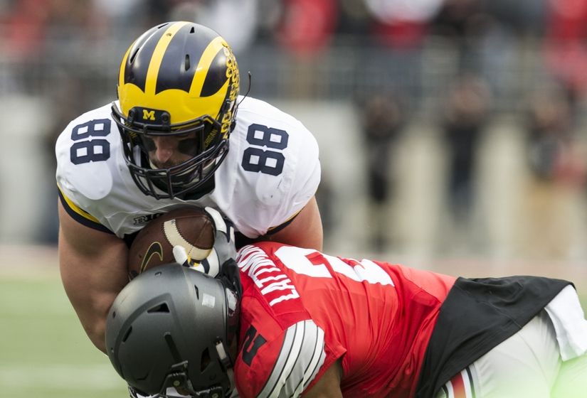 Nov 26, 2016; Columbus, OH, USA; Michigan Wolverines tight end Jake Butt (88) is tackled by Ohio State Buckeyes cornerback Marshon Lattimore (2) in the second quarter at Ohio Stadium. Mandatory Credit: Greg Bartram-USA TODAY Sports