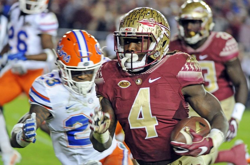 Nov 26, 2016; Tallahassee, FL, USA; Florida State Seminoles running back Dalvin Cook (4) runs the ball for a touchdown past Florida Gators defensive back Chauncey Gardner Jr. (23) during the first quarter at Doak Campbell Stadium. Mandatory Credit: Melina Vastola-USA TODAY Sports