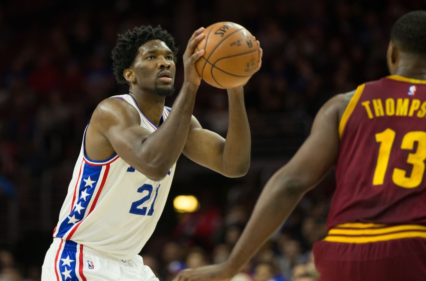 Nov 27, 2016; Philadelphia, PA, USA; Philadelphia 76ers center Joel Embiid (21) shoots and scores on a three point shot against Cleveland Cavaliers center Tristan Thompson (13) during the first quarter at Wells Fargo Center. Mandatory Credit: Bill Streicher-USA TODAY Sports