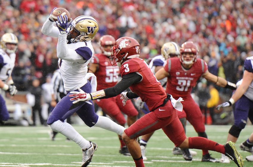Nov 25, 2016; Pullman, WA, USA; Washington Huskies wide receiver John Ross (1) makes a catch in front of Washington State Cougars cornerback Darrien Molton (3) during the first half at Martin Stadium. Mandatory Credit: James Snook-USA TODAY Sports