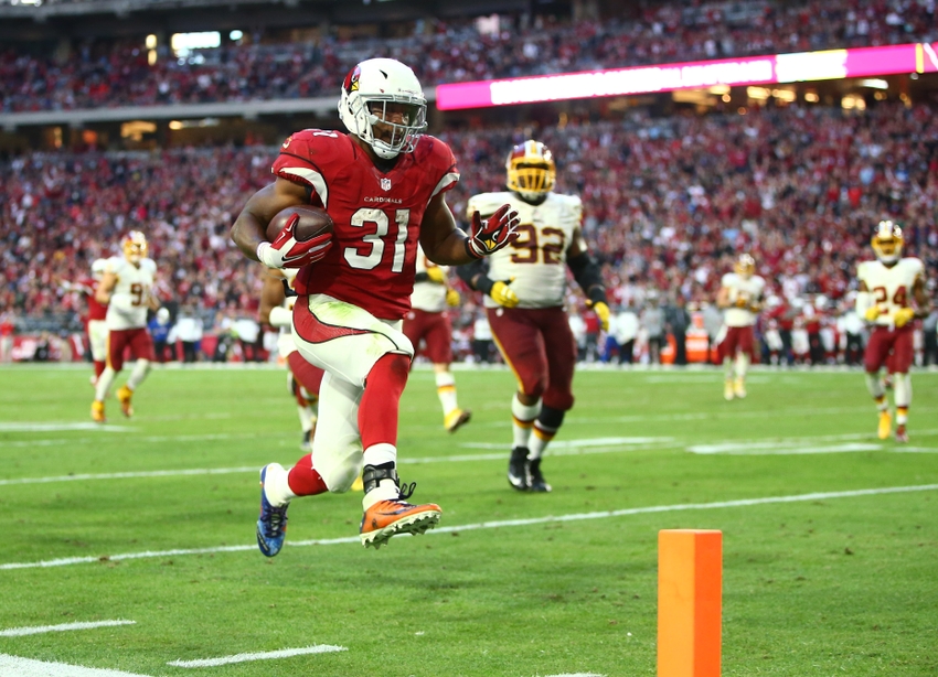 Dec 4, 2016; Glendale, AZ, USA; Arizona Cardinals running back David Johnson (31) runs for a fourth quarter touchdown against the Washington Redskins at University of Phoenix Stadium. The Cardinals defeated the Redskins 31-23. Mandatory Credit: Mark J. Rebilas-USA TODAY Sports
