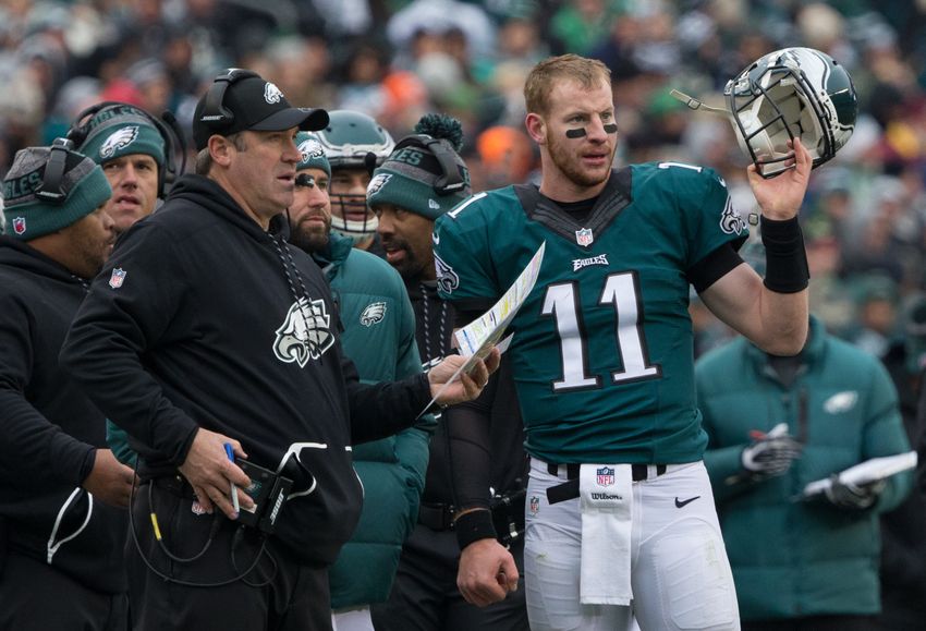Dec 11, 2016; Philadelphia, PA, USA; Philadelphia Eagles quarterback Carson Wentz (11) talks with head coach Doug Pederson during the second quarter against the Washington Redskins at Lincoln Financial Field. Mandatory Credit: Bill Streicher-USA TODAY Sports