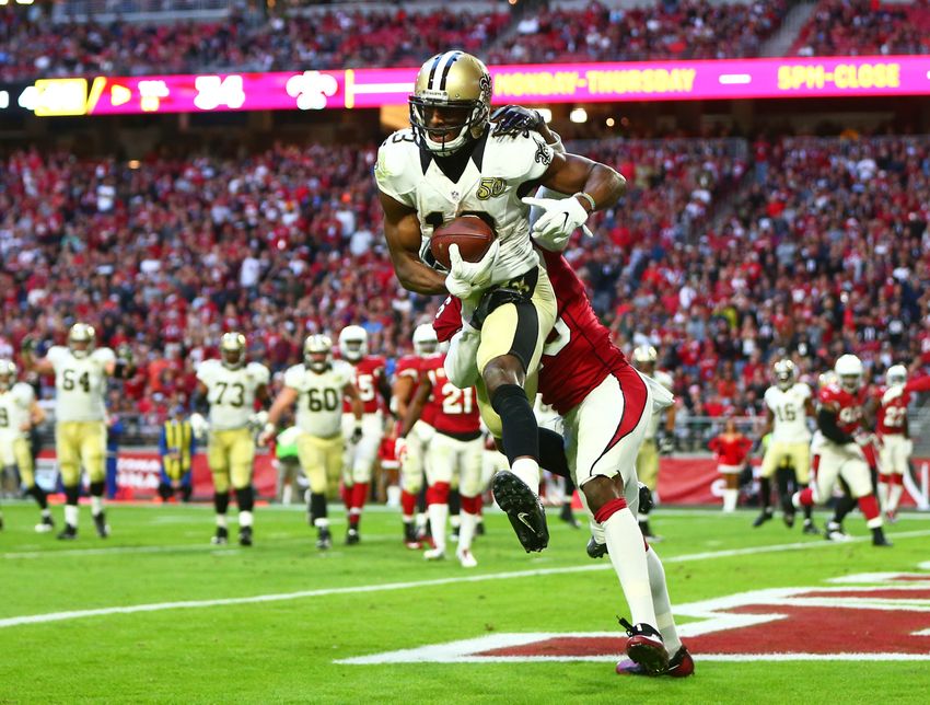 Dec 18, 2016; Glendale, AZ, USA; New Orleans Saints wide receiver Michael Thomas (13) catches a touchdown against Arizona Cardinals cornerback Brandon Williams (13) in the fourth quarter at University of Phoenix Stadium. The Saints defeated the Cardinals 48-41. Mandatory Credit: Mark J. Rebilas-USA TODAY Sports