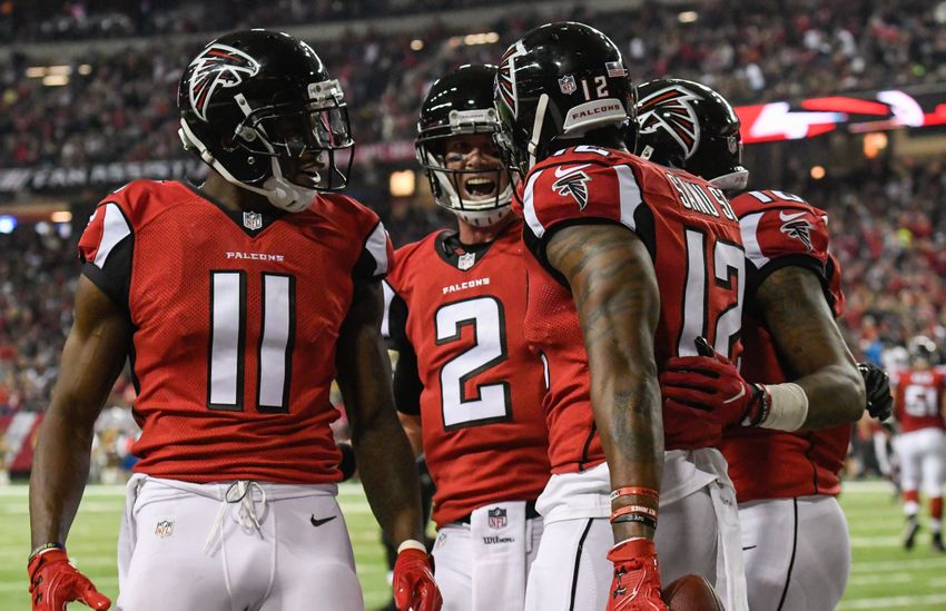 Jan 1, 2017; Atlanta, GA, USA; Atlanta Falcons wide receiver Mohamed Sanu (12) reacts with wide receiver Julio Jones (11) and quarterback Matt Ryan (2) after catching a touchdown pass against the New Orleans Saints during the first half at the Georgia Dome. Mandatory Credit: Dale Zanine-USA TODAY Sports