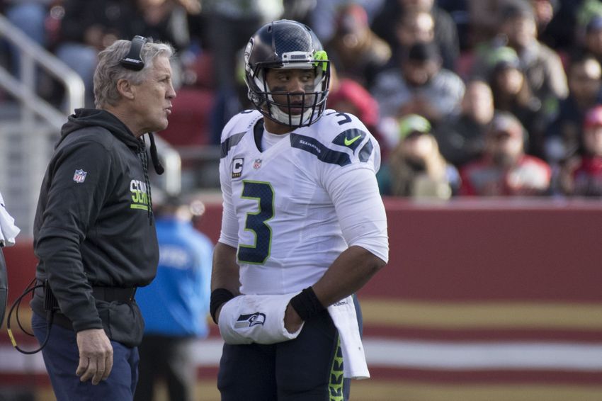 January 1, 2017; Santa Clara, CA, USA; Seattle Seahawks head coach Pete Carroll (left) and quarterback Russell Wilson (3) talk against the San Francisco 49ers during the second quarter at Levi