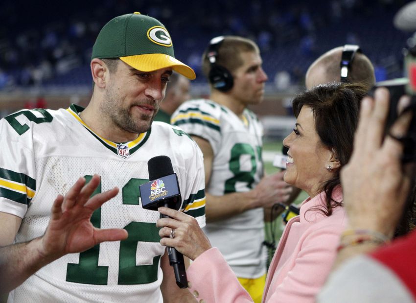 Jan 1, 2017; Detroit, MI, USA; Green Bay Packers quarterback Aaron Rodgers (12) does an interview with Michele Tafoya after the game against the Detroit Lions at Ford Field. Packers won 31-24. Mandatory Credit: Raj Mehta-USA TODAY Sports
