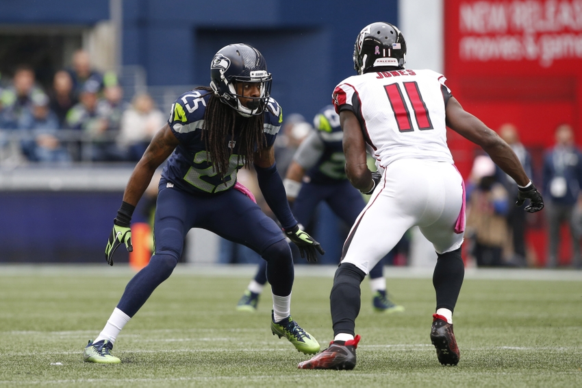 Oct 16, 2016; Seattle, WA, USA; Seattle Seahawks cornerback Richard Sherman (25) defends Atlanta Falcons wide receiver Julio Jones (11) during the second quarter at CenturyLink Field. Mandatory Credit: Joe Nicholson-USA TODAY Sports