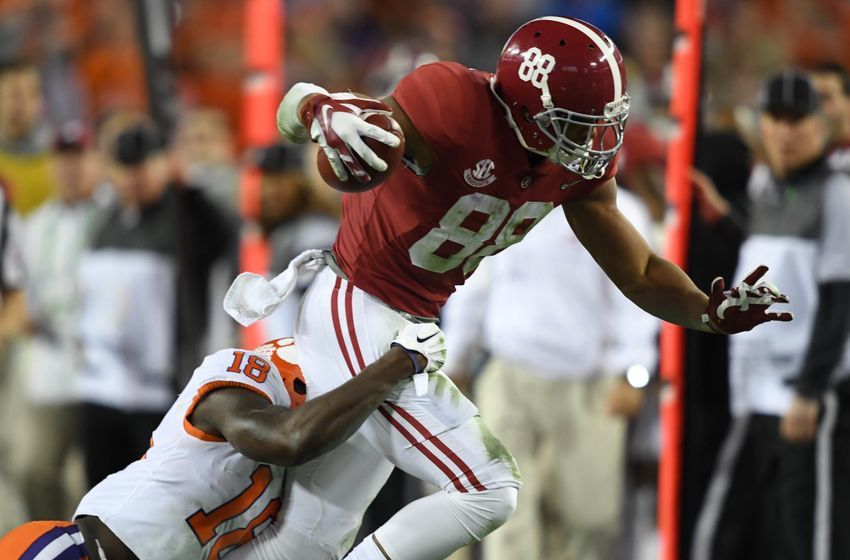 Jan 9, 2017; Tampa, FL, USA; Alabama Crimson Tide tight end O.J. Howard (88) runs the ball while guarded by Clemson Tigers safety Jadar Johnson (18) during the fourth quarter in the 2017 College Football Playoff National Championship Game at Raymond James Stadium. Mandatory Credit: John David Mercer-USA TODAY Sports