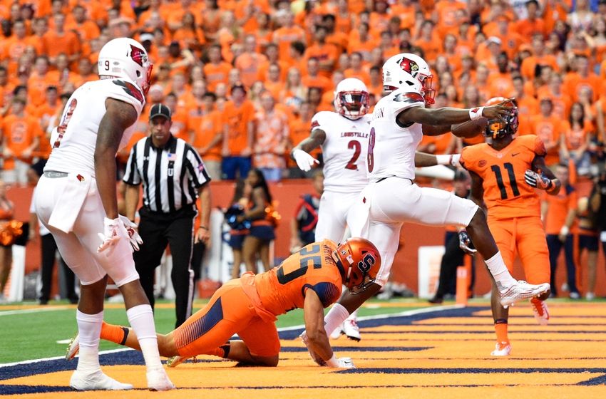 Sep 9, 2016; Syracuse, NY, USA; Louisville Cardinals quarterback Lamar Jackson (8) runs into the end zone for a touchdown against the Syracuse Orange during the first quarter at the Carrier Dome. Mandatory Credit: Rich Barnes-USA TODAY Sports