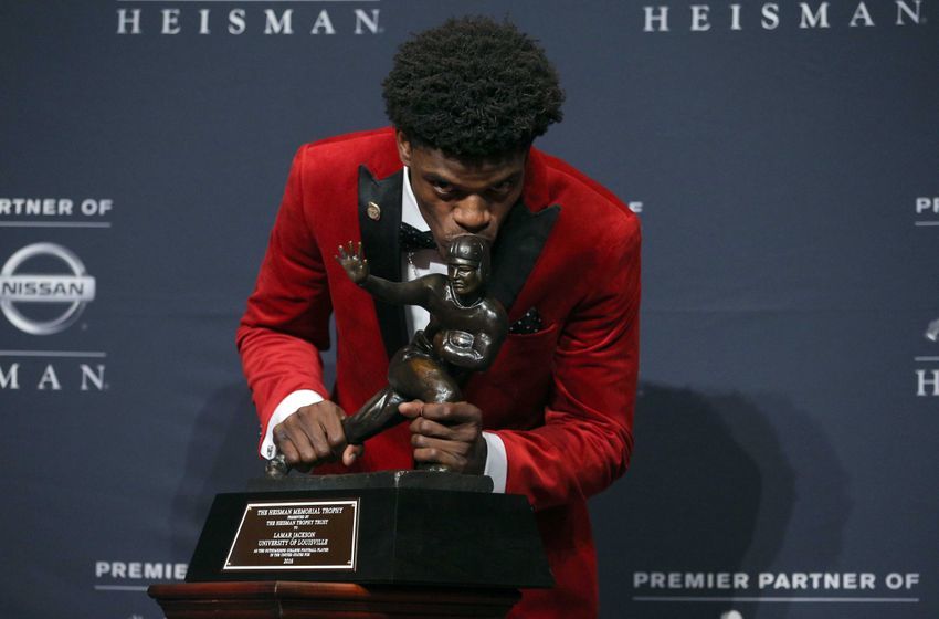 Dec 10, 2016; New York, NY, USA; Louisville quarterback Lamar Jackson poses with the trophy during a press conference at the New York Marriott Marquis after winning the 2016 Heisman Trophy award during a presentation at the Playstation Theater. Mandatory Credit: Brad Penner-USA TODAY Sports