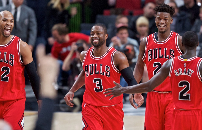 Nov 15, 2016; Portland, OR, USA; Chicago Bulls forward Taj Gibson (22) and guard Dwyane Wade (3) and forward Jimmy Butler (21) and guard Jerian Grant (2) react after a dunk by Wade against the Portland Trail Blazers during the third quarter at the Moda Center. Mandatory Credit: Craig Mitchelldyer-USA TODAY Sports