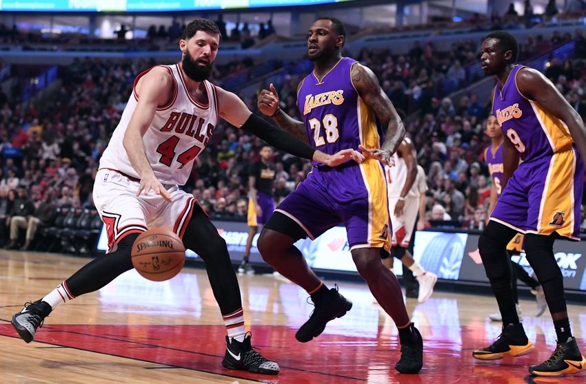 Nov 30, 2016; Chicago, IL, USA; Chicago Bulls forward Nikola Mirotic (44) dribbles the ball against Los Angeles Lakers center Tarik Black (28) during the first half at the United Center. Mandatory Credit: Mike DiNovo-USA TODAY Sports