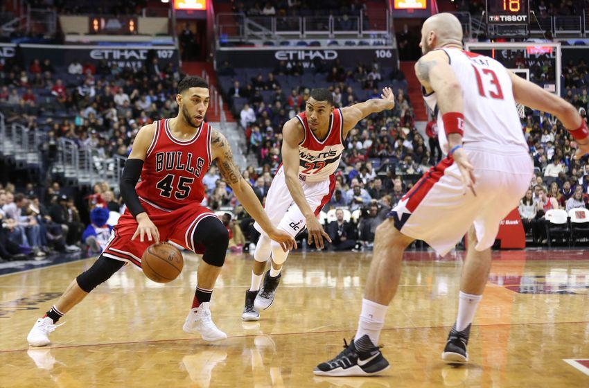 Jan 10, 2017; Washington, DC, USA; Chicago Bulls guard Denzel Valentine (45) dribbles the ball as Washington Wizards forward Otto Porter Jr. (22) and Wizards center Marcin Gortat (13) defend in the fourth quarter at Verizon Center. The Wizards won 101-99. Mandatory Credit: Geoff Burke-USA TODAY Sports