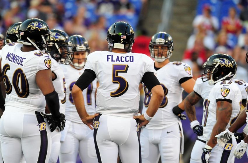 Aug 7, 2014; Baltimore, MD, USA; Baltimore Ravens quarterback Joe Flacco (5) stands in the huddle in the first quarter against the San Francisco 49ers at M&T Bank Stadium. Mandatory Credit: Evan Habeeb-USA TODAY Sports