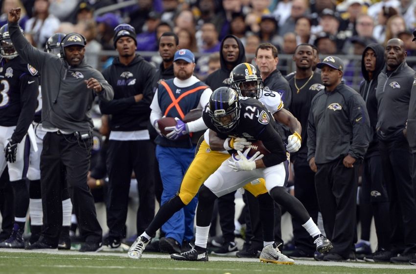 Dec 27, 2015; Baltimore, MD, USA; Baltimore Ravens cornerback Jimmy Smith (22) intercepts Pittsburgh Steelers quarterback Ben Roethlisberger (7) (not pictured) pass intended for wide receiver Antonio Brown (84) during the fourth quarter at M&T Bank Stadium. Baltimore Ravens defeated Pittsburgh Steelers 20-17. Mandatory Credit: Tommy Gilligan-USA TODAY Sports