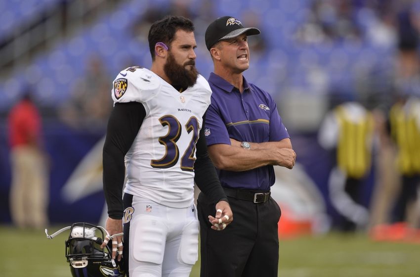 Aug 11, 2016; Baltimore, MD, USA; Baltimore Ravens head coach John Harbaugh speaks with defensive back Eric Weddle (32) before the game against the Carolina Panthers at M&T Bank Stadium. Mandatory Credit: Tommy Gilligan-USA TODAY Sports