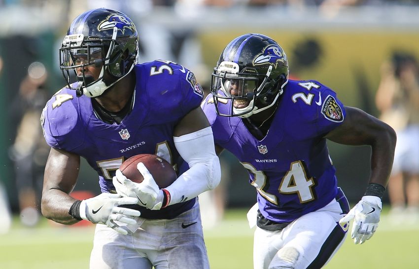 Sep 25, 2016; Jacksonville, FL, USA; Baltimore Ravens cornerback Kyle Arrington (24) and inside linebacker Zach Orr (54) run after intercepting the ball during the second half of a football game against the Jacksonville Jaguarsat EverBank Field. The Baltimore Ravens won 19-17. Mandatory Credit: Reinhold Matay-USA TODAY Sports