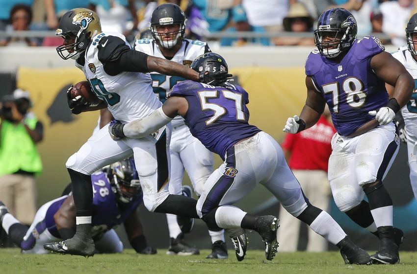 Sep 25, 2016; Jacksonville, FL, USA; Baltimore Ravens inside linebacker C.J. Mosley (57) tackles Jacksonville Jaguars tight end Julius Thomas (80) in second half at EverBank Field. Baltimore Ravens won 19-17. Mandatory Credit: Logan Bowles-USA TODAY Sports