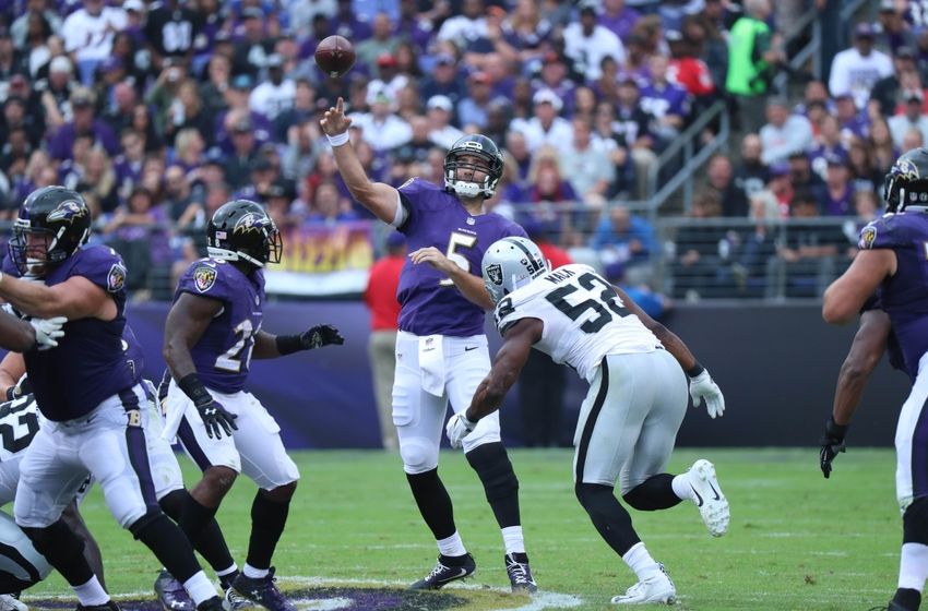 Oct 2, 2016; Baltimore, MD, USA; Baltimore Ravens quarterback Joe Flacco (5) pressured by Oakland Raiders linebacker Khalil Mack (52) at M&T Bank Stadium. Mandatory Credit: Mitch Stringer-USA TODAY Sports