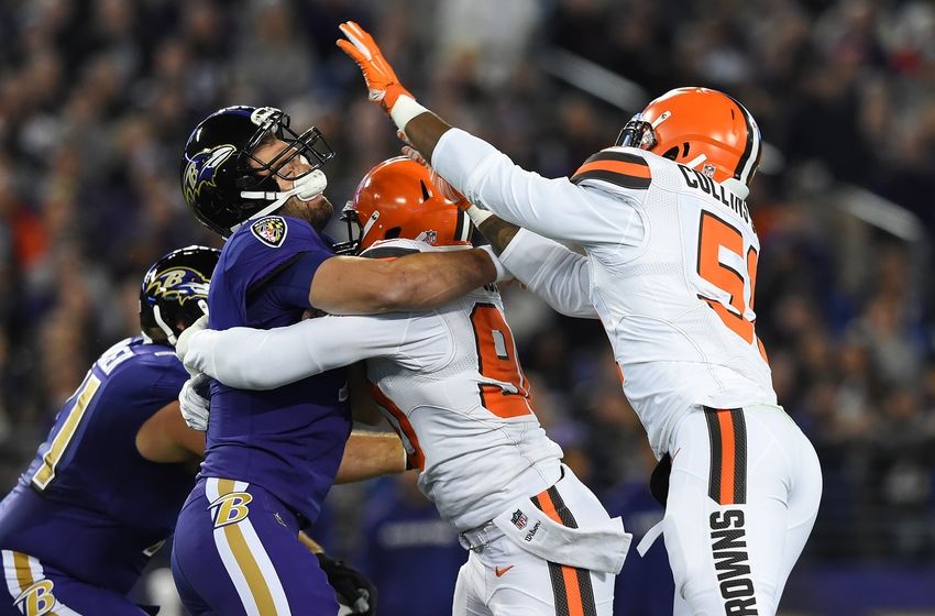 Nov 10, 2016; Baltimore, MD, USA; Cleveland Browns outside linebacker Emmanuel Ogbah (90) hits Baltimore Ravens quarterback Joe Flacco (5) after the pass during the first quarter at M&T Bank Stadium. Mandatory Credit: Tommy Gilligan-USA TODAY Sports