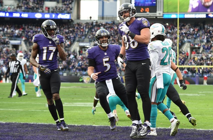 Dec 4, 2016; Baltimore, MD, USA; Baltimore Ravens tight end Dennis Pitta (88) celebrates with quarterback Joe Flacco (5) and wide receiver Mike Wallace (17) after scoring a touchdown during the second quarter against the Miami Dolphins at M&T Bank Stadium. Mandatory Credit: Tommy Gilligan-USA TODAY Sports