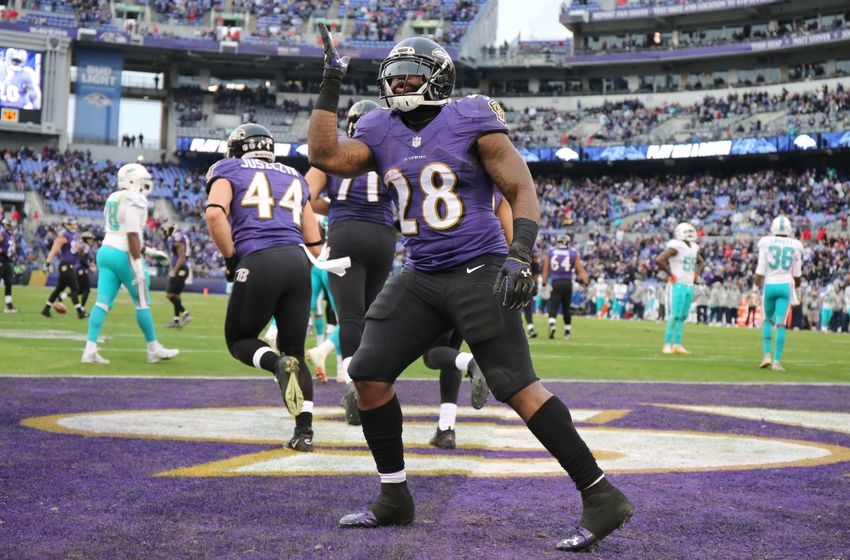 Dec 4, 2016; Baltimore, MD, USA; Baltimore Ravens running back Terrance West (28) blows a kiss to the fans after his fourth quarter touchdown against the Miami Dolphins at M&T Bank Stadium. Mandatory Credit: Mitch Stringer-USA TODAY Sports