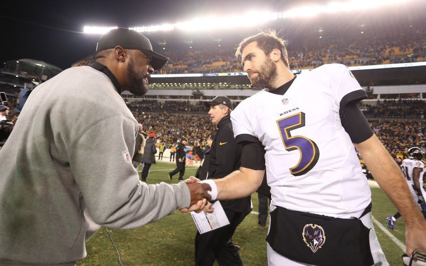 Dec 25, 2016; Pittsburgh, PA, USA; Pittsburgh Steelers head coach Mike Tomlin (left) shakes hands with Baltimore Ravens quarterback Joe Flacco (5) after their game at Heinz Field. The Steelers won 31-27. Mandatory Credit: Charles LeClaire-USA TODAY Sports