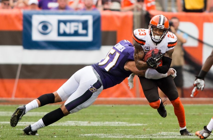 Sep 18, 2016; Cleveland, OH, USA; Cleveland Browns cornerback Joe Haden (23) gets hit by Baltimore Ravens linebacker Kamalei Correa (51) while returning a punt during the third quarter at FirstEnergy Stadium. The Ravens defeated the Browns 25-20. Mandatory Credit: Scott R. Galvin-USA TODAY Sports