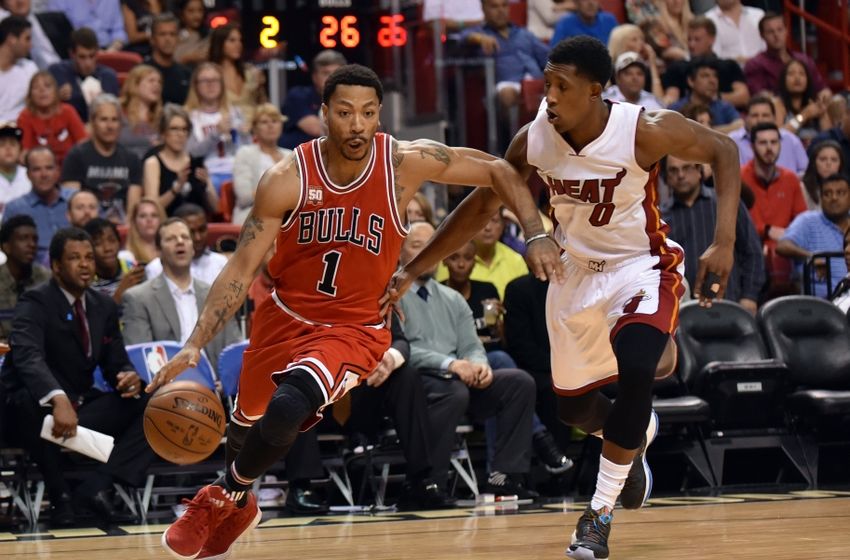 Apr 7, 2016; Miami, FL, USA; Chicago Bulls guard Derrick Rose (1) dribbles the ball as Miami Heat guard Josh Richardson (0) defends during the first half at American Airlines Arena. Mandatory Credit: Steve Mitchell-USA TODAY Sports