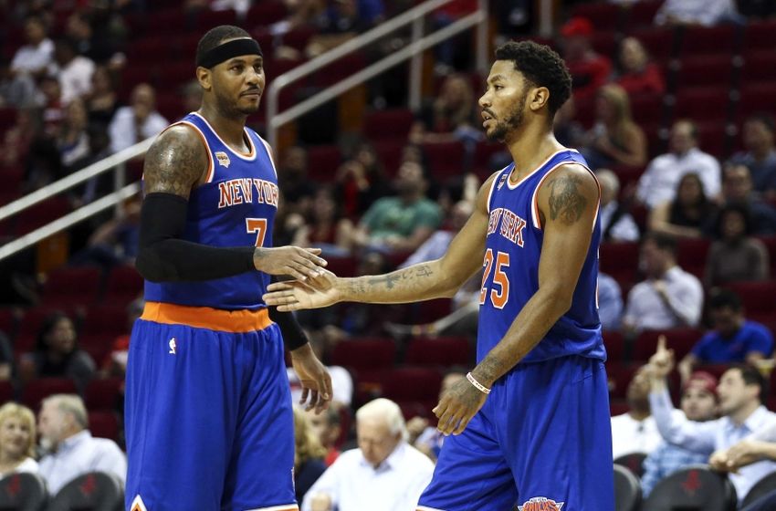 Oct 4, 2016; Houston, TX, USA; New York Knicks guard Derrick Rose (25) celebrates with forward Carmelo Anthony (7) after a play during the third quarter against the Houston Rockets at Toyota Center. The Rockets won 130-103. Mandatory Credit: Troy Taormina-USA TODAY Sports