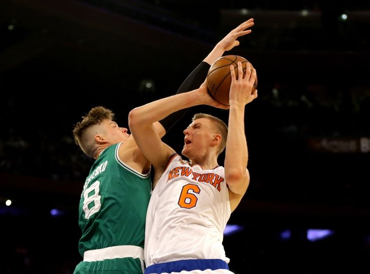 Oct 15, 2016; New York, NY, USA; New York Knicks forward Kristaps Porzingis (6) goes up for a shot against Boston Celtics forward Jonas Jerebko (8) during the first half at Madison Square Garden. The Celtics won 119-107. Mandatory Credit: Andy Marlin-USA TODAY Sports
