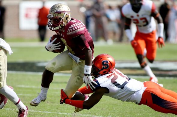 Oct 31, 2015; Tallahassee, FL, USA; Florida State Seminoles wide receiver Kermit Whitfield (8) picks up a first down against the Syracuse Orange cornerback Cordell Hudson (20) at Doak Campbell Stadium. Mandatory Credit: Glenn Beil-USA TODAY Sports