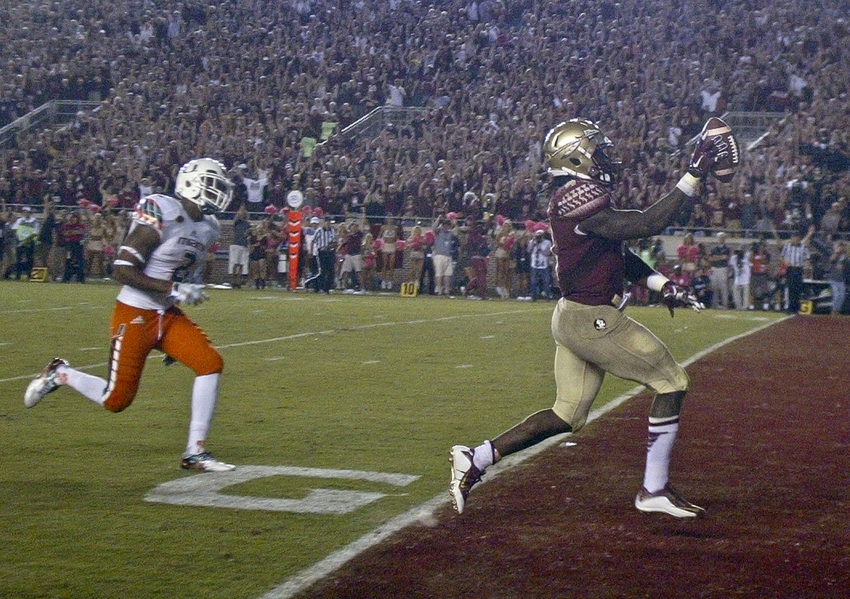 Oct 10, 2015; Tallahassee, FL, USA; Florida State Seminoles running back Dalvin Cook (4) scores his third touchdown, in the fourth quarter of their game against the Miami Hurricanes at Doak Campbell Stadium. The Florida State Seminoles won 29-24. Mandatory Credit: Phil Sears-USA TODAY Sports