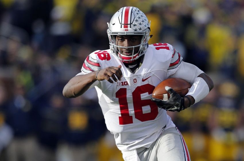 Nov 28, 2015; Ann Arbor, MI, USA; Ohio State Buckeyes quarterback J.T. Barrett (16) rushes in the second half against the Ohio State Buckeyes at Michigan Stadium. Ohio State won 42-13. Mandatory Credit: Rick Osentoski-USA TODAY Sports