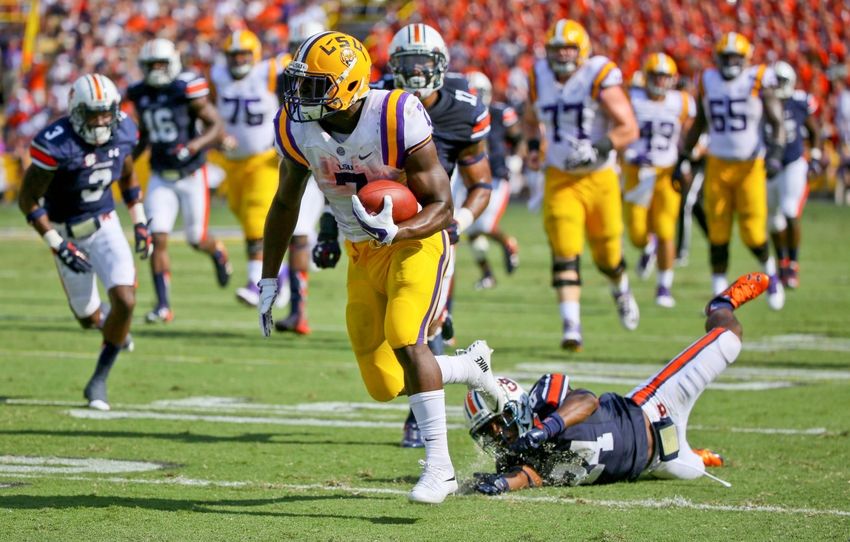Sep 19, 2015; Baton Rouge, LA, USA; LSU Tigers running back Leonard Fournette (7) breaks away from Auburn Tigers cornerback Ed Paris (24) for a touchdown during the second quarter of a game at Tiger Stadium. Mandatory Credit: Derick E. Hingle-USA TODAY Sports