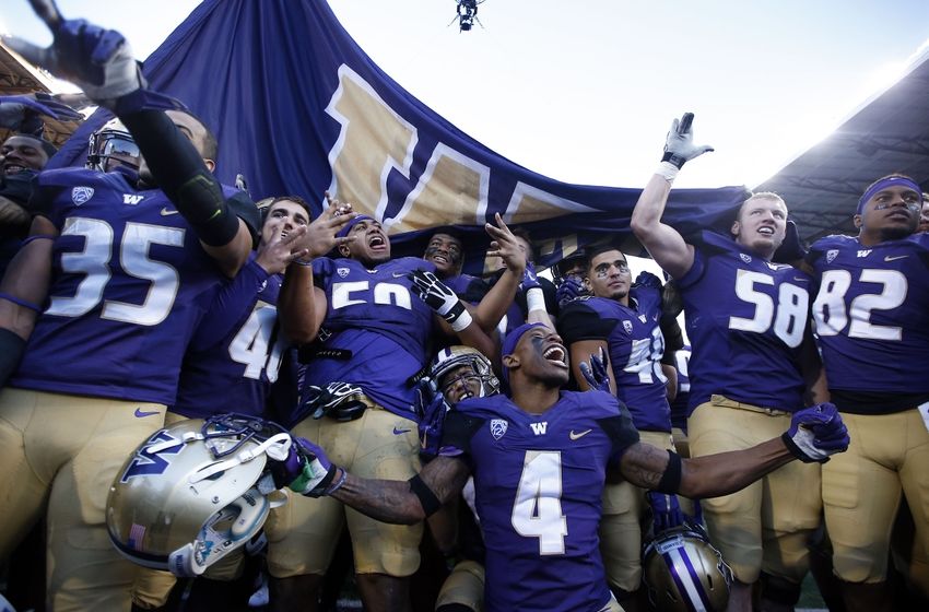 Nov 27, 2015; Seattle, WA, USA; The Washington Huskies celebrate their win over the Washington State Cougars at Husky Stadium. Washington beat Washington State 45-10. Mandatory Credit: Jennifer Buchanan-USA TODAY Sports