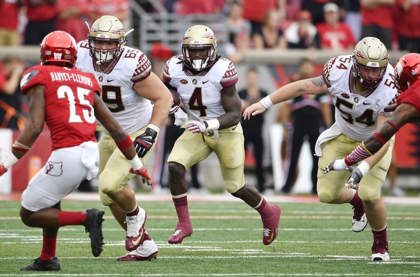 Sep 17, 2016; Louisville, KY, USA; Florida State Seminoles running back Dalvin Cook (4) runs the ball against the Louisville Cardinals during the first quarter at Papa John's Cardinal Stadium. Mandatory Credit: Jamie Rhodes-USA TODAY Sports