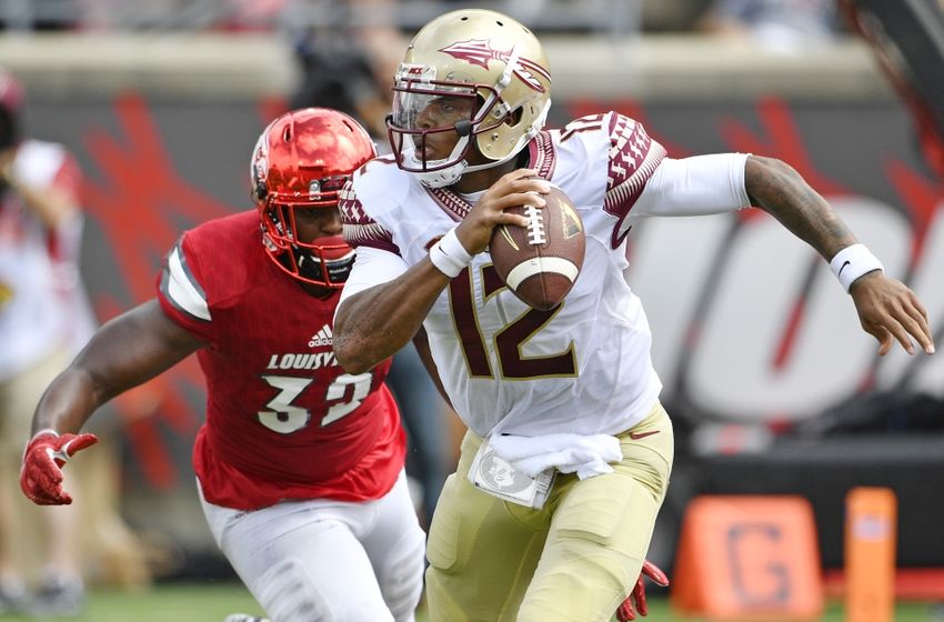 Sep 17, 2016; Louisville, KY, USA; Florida State Seminoles quarterback Deondre Francois (12) scrambles with ball to evade Louisville Cardinals linebacker Stacy Thomas (32) during the second half at Papa John's Cardinal Stadium. Louisville defeated Florida State 63-20. Mandatory Credit: Jamie Rhodes-USA TODAY Sports