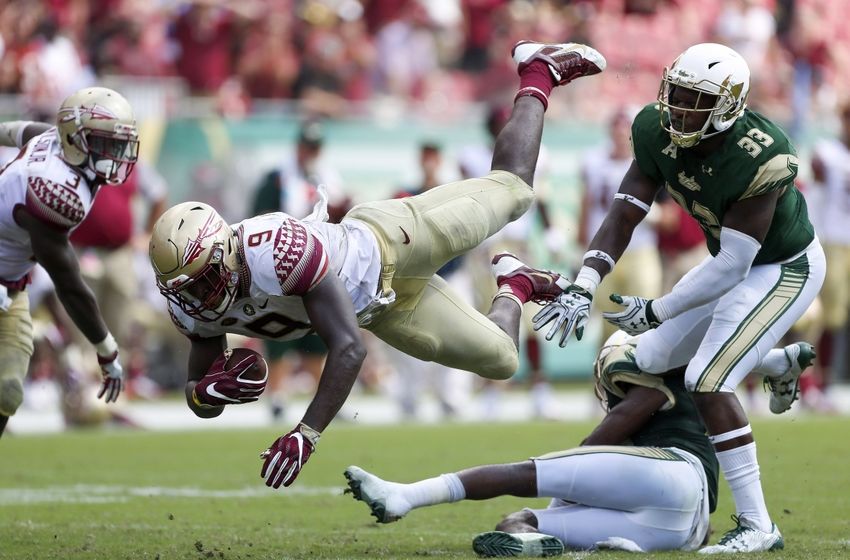 Sep 24, 2016; Tampa, FL, USA; Florida State Seminoles running back Jacques Patrick (9) dives forward in the second half as South Florida Bulls linebacker Cecil Cherry (33) defends in the second half at Raymond James Stadium. Florida State Seminoles won 55-35. Mandatory Credit: Logan Bowles-USA TODAY Sports