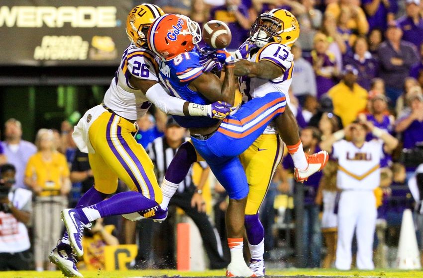 Oct 17, 2015; Baton Rouge, LA, USA; LSU Tigers safety John Battle (26) and defensive back Dwayne Thomas (13) break up a pass to Florida Gators wide receiver Antonio Callaway (81) during the fourth quarter of a game at Tiger Stadium. LSU defeated Florida 35-28.Mandatory Credit: Derick E. Hingle-USA TODAY Sports