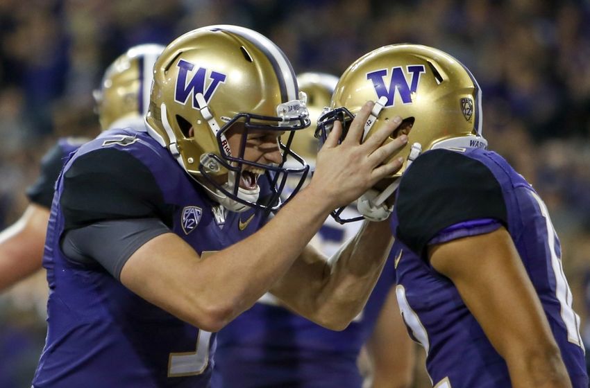 Sep 30, 2016; Seattle, WA, USA; Washington Huskies quarterback Jake Browning (3) celebrates with wide receiver Aaron Fuller (12) after a three-yard touchdown pass from Browning to Fuller during the second half at Husky Stadium. Washington won 44-6. Mandatory Credit: Jennifer Buchanan-USA TODAY Sports