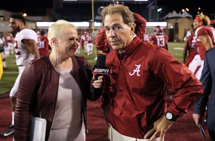 Oct 8, 2016; Fayetteville, AR, USA; Alabama Crimson Tide head coach Nick Saban talks to ESPN reporter Holly Rowe after the game against the Arkansas Razorbacks at Donald W. Reynolds Razorback Stadium. Alabama defeated Arkansas 49-30. Mandatory Credit: Nelson Chenault-USA TODAY Sports