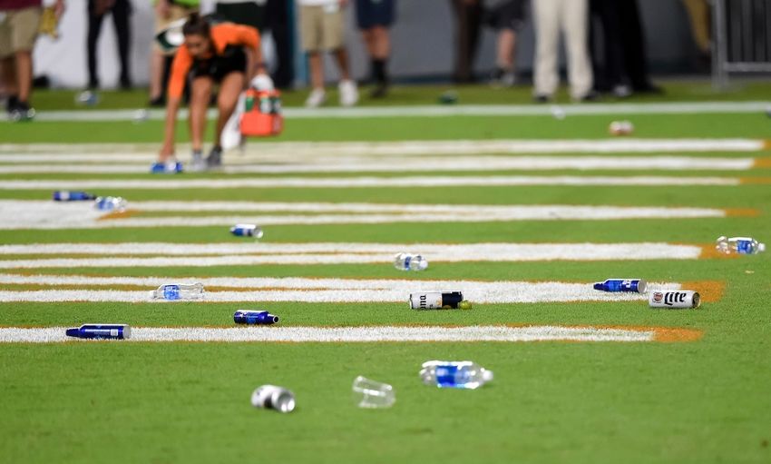 Oct 8, 2016; Miami Gardens, FL, USA; Fans throw items onto the field during the second half of a game between the Florida State Seminoles and the Miami Hurricanes at Hard Rock Stadium. FSU won 20-19. Mandatory Credit: Steve Mitchell-USA TODAY Sports