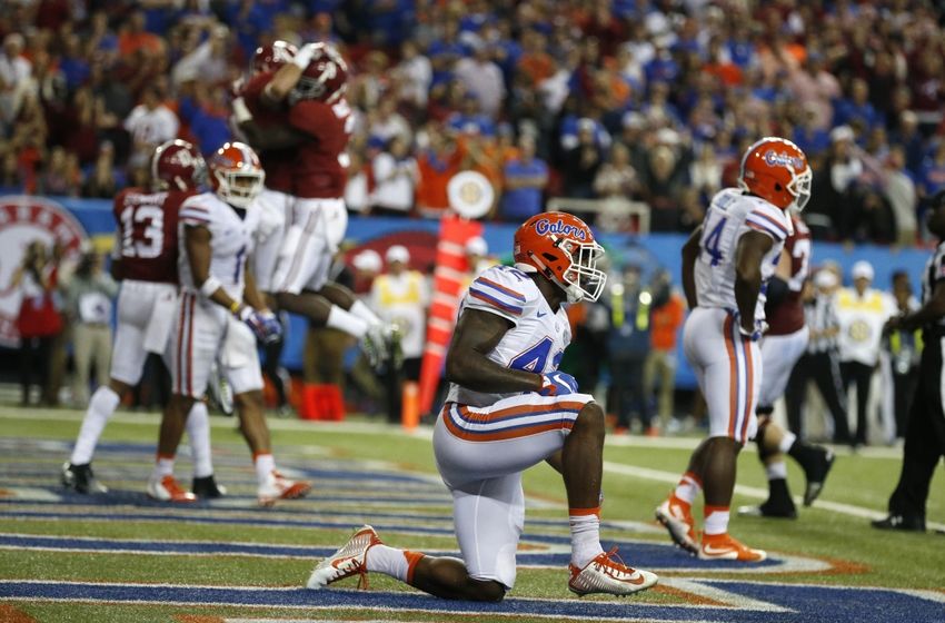Dec 5, 2015; Atlanta, GA, USA; Florida Gators defensive back Keanu Neal (42) reacts as Alabama Crimson Tide wide receiver Richard Mullaney (16) celebrates a touchdown during the fourth quarter of the 2015 SEC Championship Game at the Georgia Dome. Mandatory Credit: Jason Getz-USA TODAY Sports