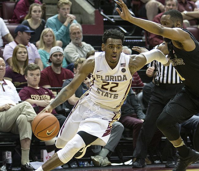 Dec 28, 2016; Tallahassee, FL, USA; Florida State Seminoles guard Xavier Rathan-Mayes (22) to the basket against a Wake Forest Demon Deacon defender at the Donald L. Tucker Center. Florida State won 88-72. Mandatory Credit: Glenn Beil-USA TODAY Sports