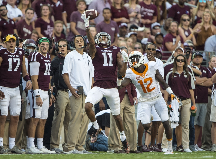 Oct 8, 2016; College Station, TX, USA; Texas A&M Football. Aggies wide receiver Josh Reynolds (11) makes a one handed catch as Tennessee Volunteers defensive back Emmanuel Moseley (12) defends during the second half at Kyle Field. The Aggies defeated the Volunteers 45-38 in overtime. Mandatory Credit: Jerome Miron-USA TODAY Sports