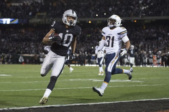 December 24, 2015; Oakland, CA, USA; Oakland Raiders wide receiver Seth Roberts (10) runs past San Diego Chargers cornerback Adrian Phillips (31) for a two-point conversion during the fourth quarter at O.co Coliseum. The Raiders defeated the Chargers 23-20. Mandatory Credit: Kyle Terada-USA TODAY Sports
