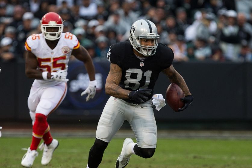 Dec 6, 2015; Oakland, CA, USA; Oakland Raiders tight end Mychal Rivera (81) carries the ball against the Kansas City Chiefs during the second quarter at O.co Coliseum. Mandatory Credit: Kelley L Cox-USA TODAY Sports