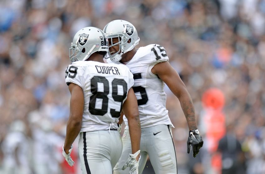 Oct 25, 2015; San Diego, CA, USA; Oakland Raiders wide receiver Michael Crabtree (15) congratulates wide receiver Amari Cooper (89) after Cooper made a second quarter against the San Diego Chargers at Qualcomm Stadium. Mandatory Credit: Jake Roth-USA TODAY Sports