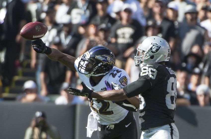 September 20, 2015; Oakland, CA, USA; Baltimore Ravens cornerback Jimmy Smith (22) blocks a pass intended for Oakland Raiders wide receiver Amari Cooper (89) during the fourth quarter at O.co Coliseum. The Raiders defeated the Ravens 37-33. Mandatory Credit: Kyle Terada-USA TODAY Sports